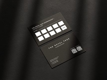 Double-sided minimal black barbershop loyalty card template mockup showing front with QR codes and reverse with stamp grid