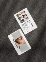 Reverse of the white barber portfolio card template showing six-photo haircut work grid with QR code, social handles and contact details