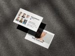 Two-sided white minimal barber portfolio business card mockup showing hero photo front and six-cut work grid with QR code reverse