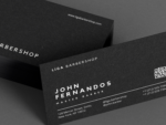 Close-up of minimal black barber business card template showing master name, QR booking code and contact details on the back face