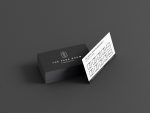 White reverse of the barbershop stamp card template showing clipper icon visit slots, 50% at visit 5 and free cut at visit 10