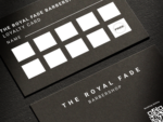 Close-up of the two QR code fields on the minimal black barbershop loyalty card template showing booking and Instagram follow placement