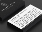 Close-up of black and white barbershop stamp card template showing clipper icons in visit slots and the 5th visit 50 percent milestone