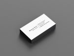 Back of minimal barber business card template showing full name, barber position, address, phone number and social media handles in vertical layout