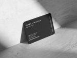 Back face of text-only barbershop business card showing shop name, barbershop label, website, address, phone number and Instagram handle in column layout